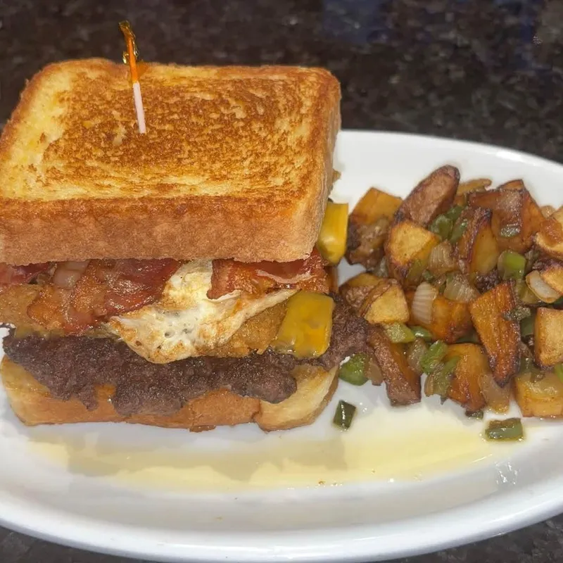 Hangover Burger with bacon, egg and breakfast potatoes
