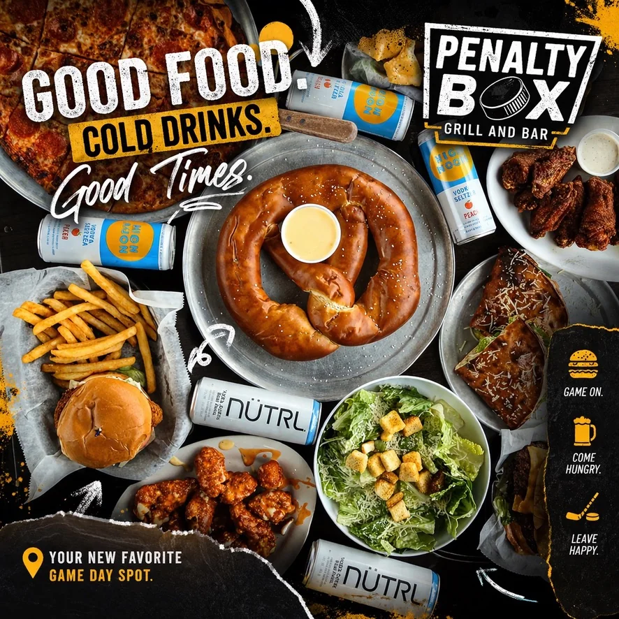 Spread of pizza, pretzel, wings, burger, fries, Caesar salad and cold drinks on the table at Penalty Box Bar & Grill in East Alton